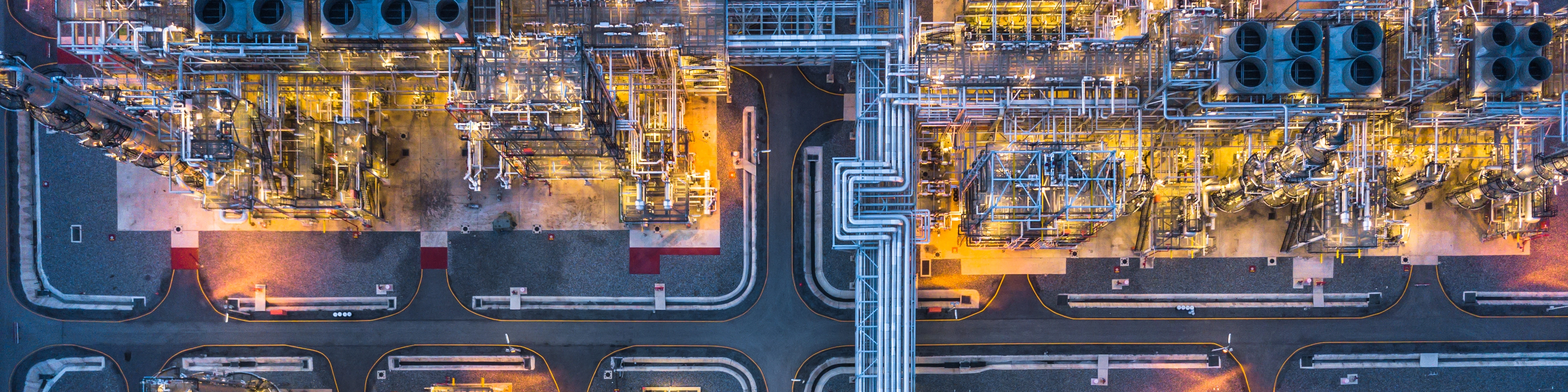 Aerial View Of Illuminated Factory In City At Night,